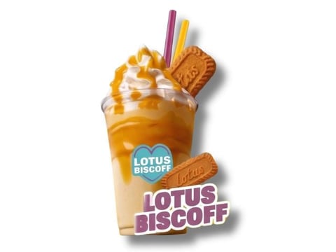 Lotus Biscoff iced drink topped with whipped cream, caramel drizzle, and Biscoff cookies