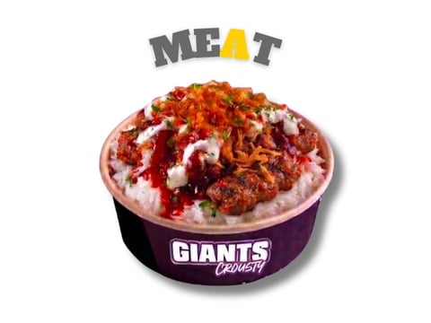 Giants Stadium meat-topped ice cream sundae with red toppings and whipped cream in purple branded cup