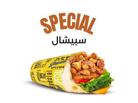 Yellow wrapped shawarma sandwich with crispy chicken, lettuce, tomato, and cheese filling
