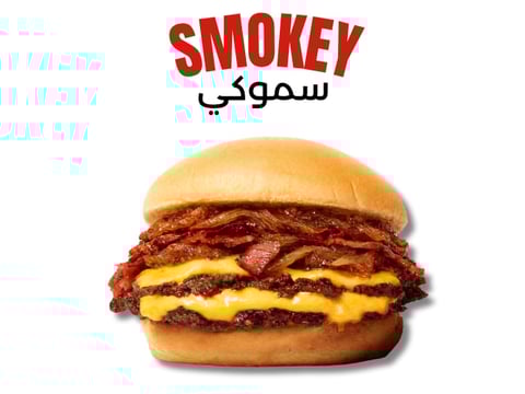 Smokey burger with melted cheese, crispy bacon, and beef patty on a toasted bun with brand name Smokey above