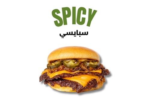 Spicy burger with double meat patties, melted cheese, and toppings on a toasted bun